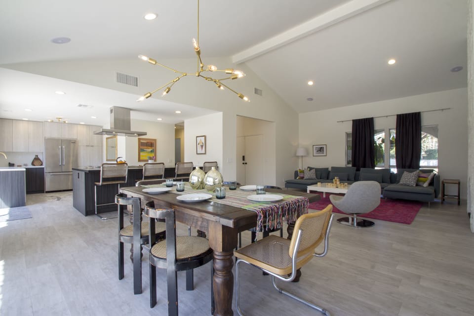 open-concept living, dining, and cooking area