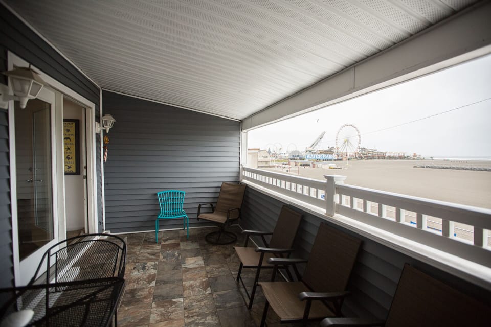 Covered porch has lots of seating and an electric George Foreman grill
