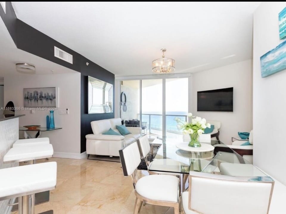 Living room & Dinning  with spectacular views as well as kitchen island seating 