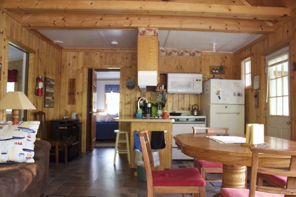 Open kitchen and dining area.  Kitchen has full size refrigerator and gas stove.