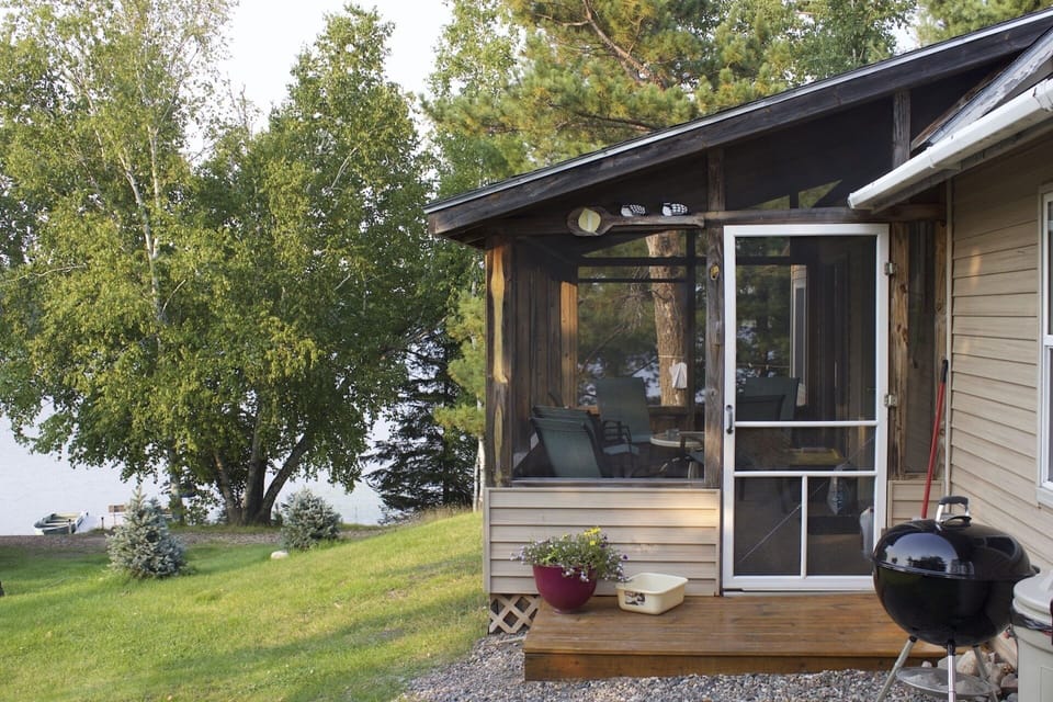 screen porch looking towards the lake and beach