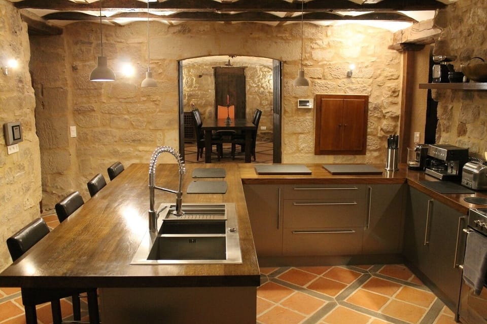 The sympathetically designed and fully fitted kitchen and vaulted dining room 