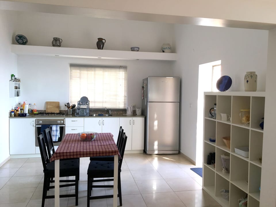 Open Kitchen and dining area with door to Terrace.