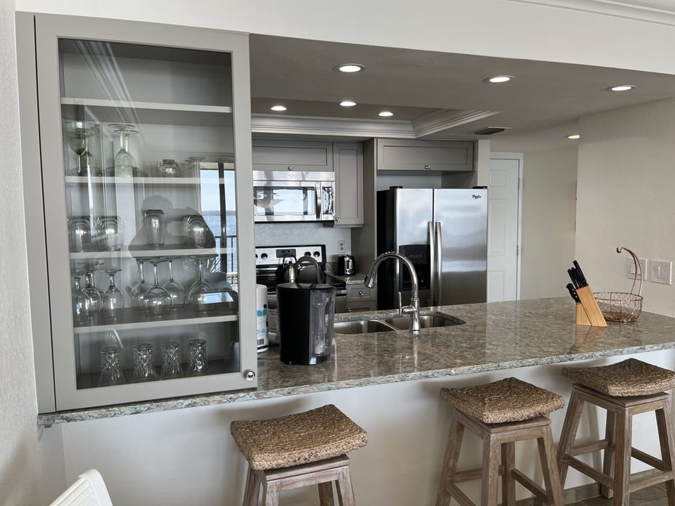 Kitchen fully renovated (January 2023) with glass  cabinet and counter seating 