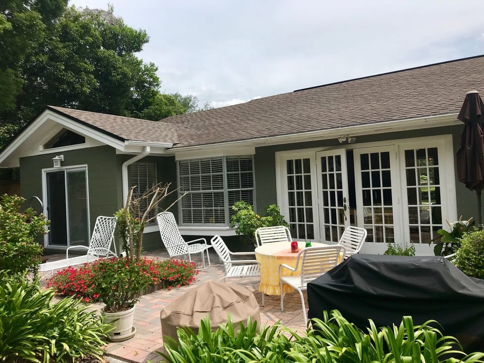 Enjoy the beautiful back yard with gas grill and outdoor seating.
