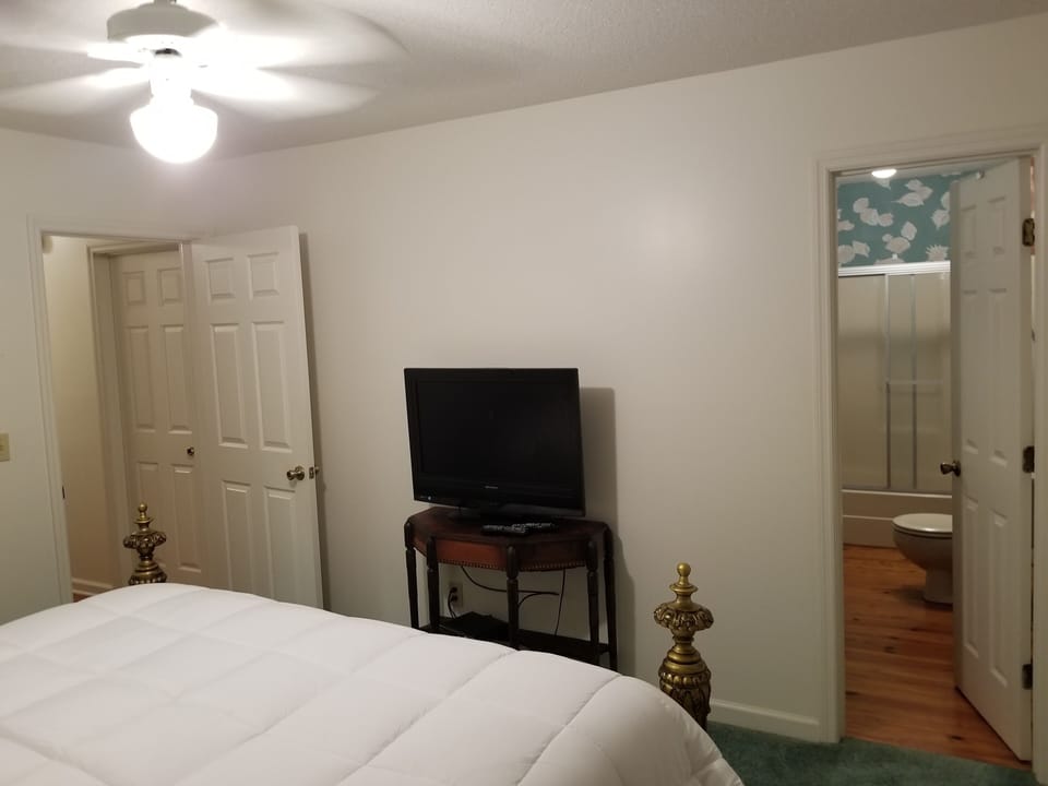 TV with Cable box in Master Bedroom, entrance to en suite private bathroom
