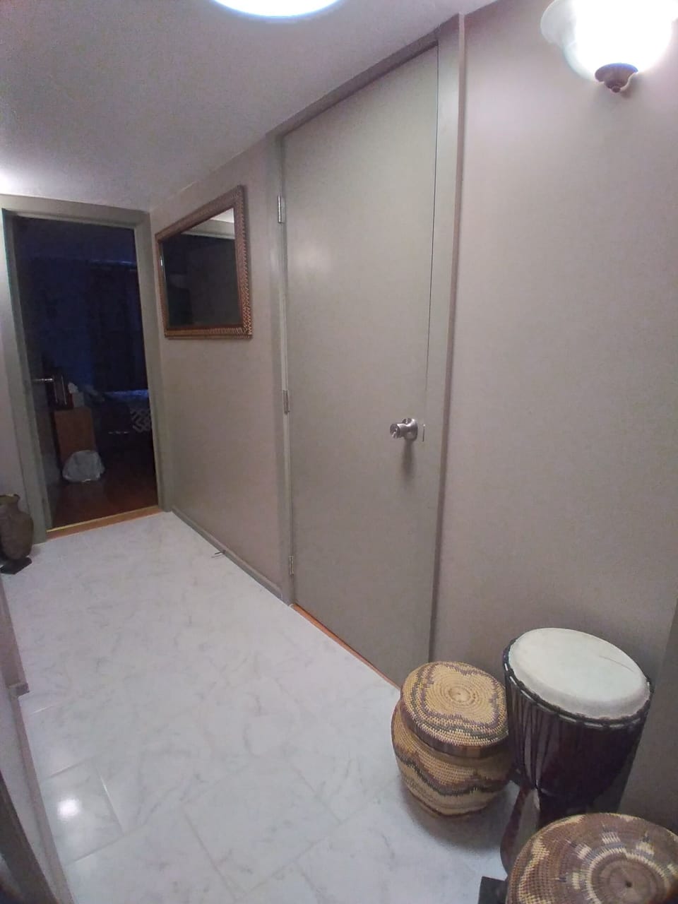 Hallway to bathroom on right and 3rd bedroom at the end of the halll