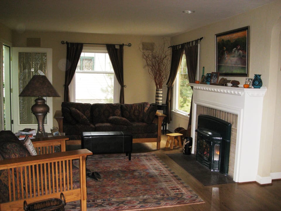 Living room.  Door to sunroom in back left.