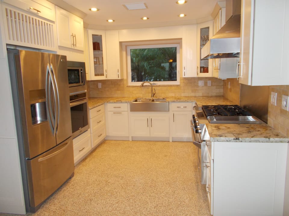 Newly remodeled chef's gourmet kitchen with six burner gas stove.