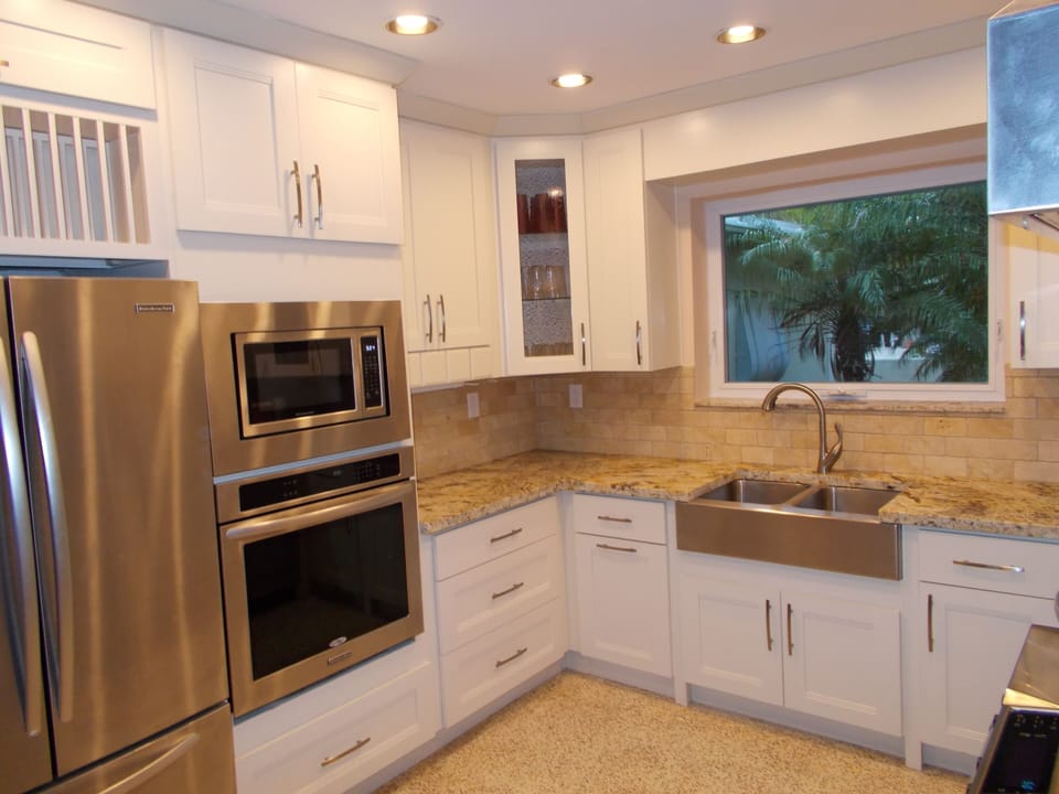 Stainless steel appliances and commercial ice maker.