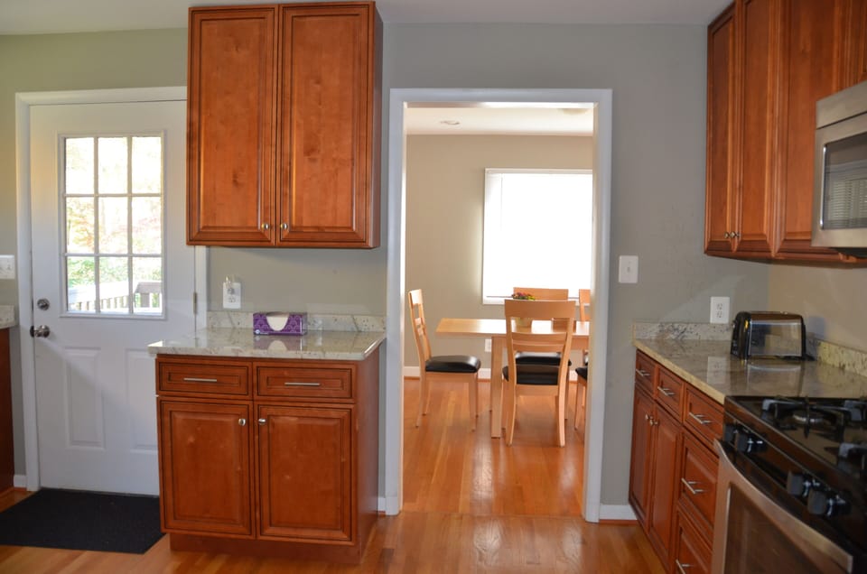 Gourmet kitchen,  connected to dining room and deck