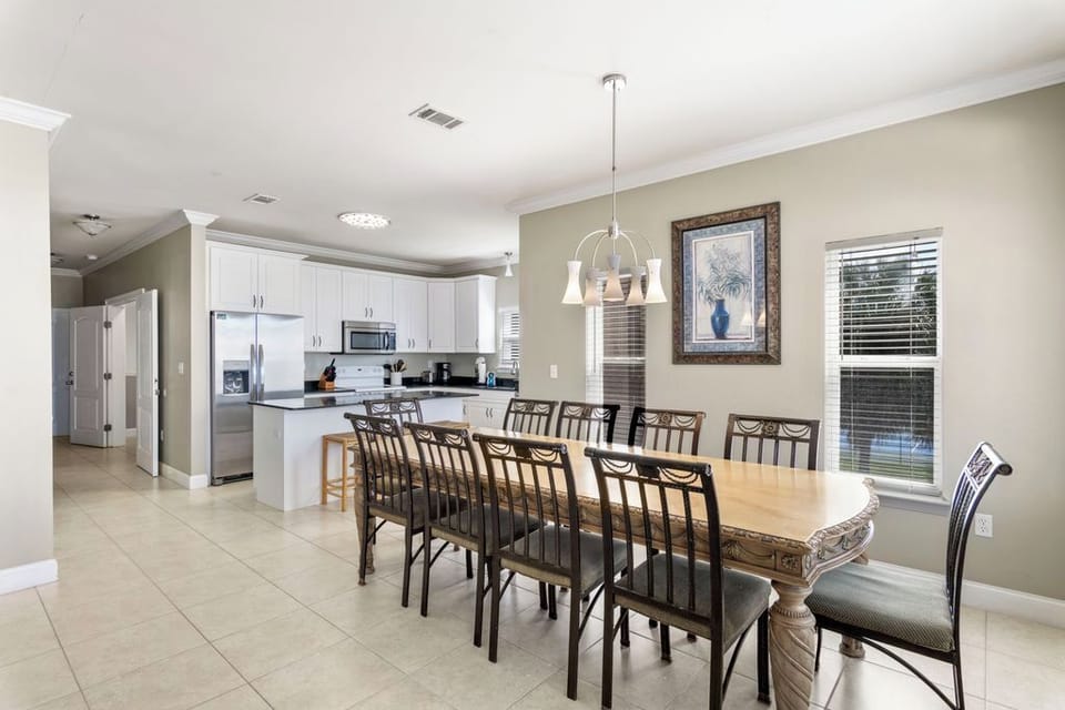 Second Floor: Dining Area– Spacious, fully equipped kitchen featuring an island with addition seating, perfect for family meals.
