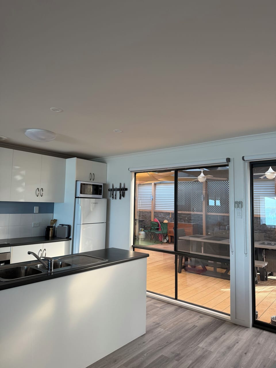 Kitchen enclosed outdoor eating area with BBQ