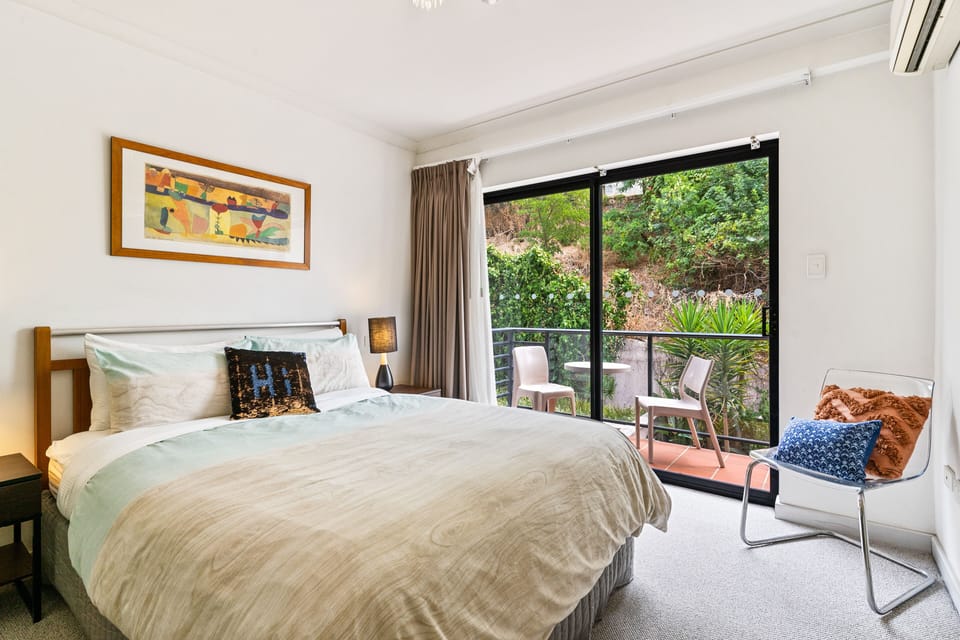 Sun lit bedroom with block out curtains for those morning sleep ins.
