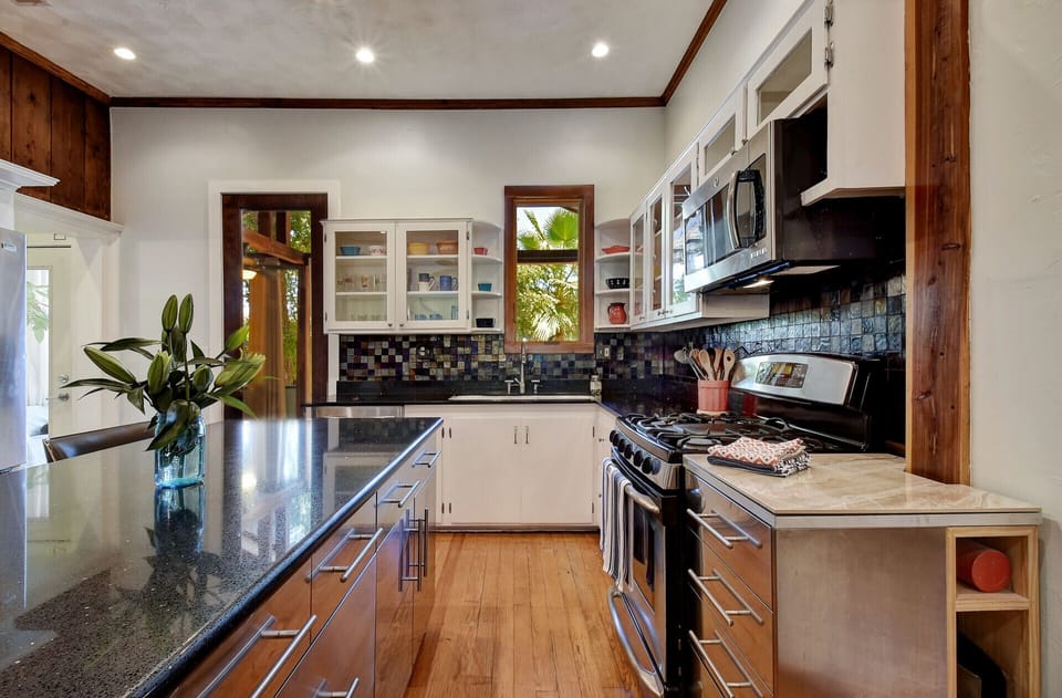 The spacious kitchen is fully equipped with everything you could need.