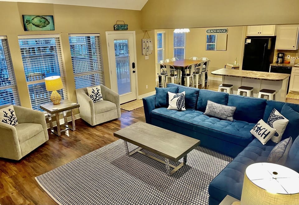 Open floor plan with kitchen overlooking living room