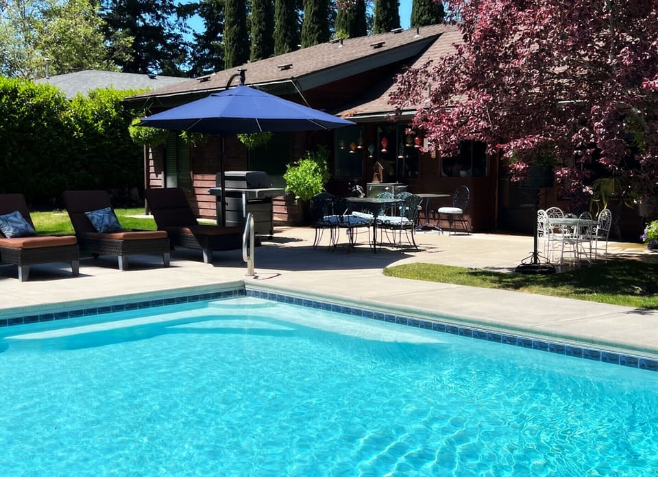 Enjoy dinner poolside on our vintage table for six.