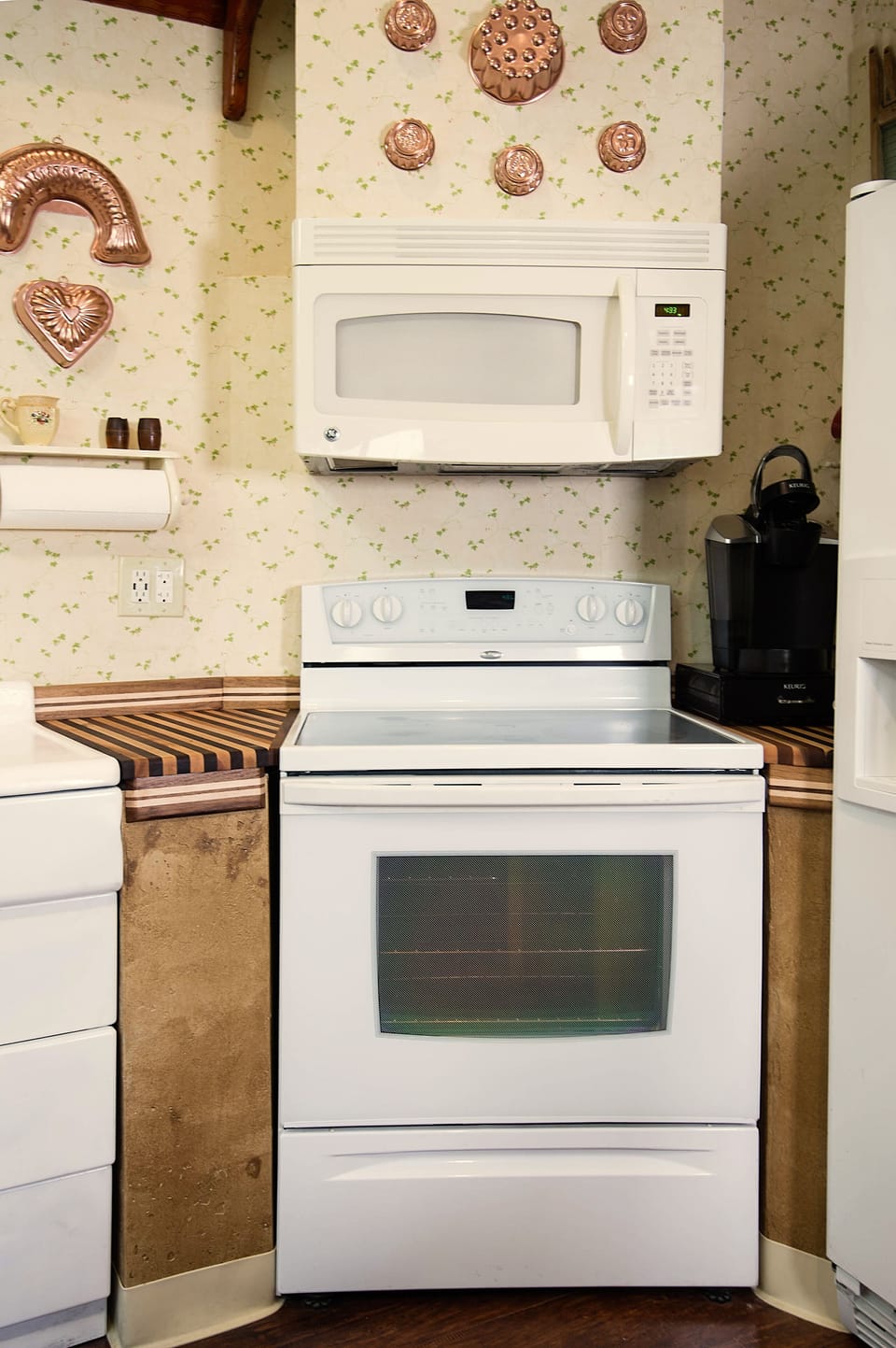 Glass top electric range and microwave above