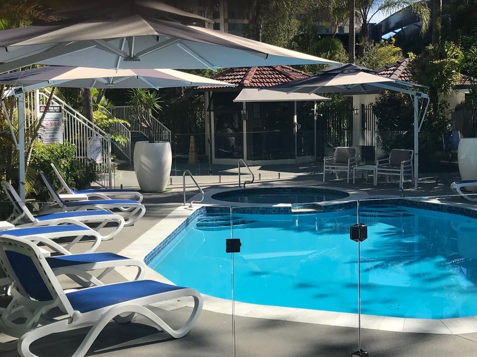 New Pool, sun lounges and umbrellas