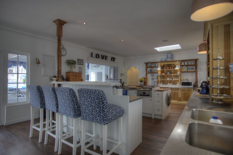 Super large gourmet and entertainers kitchen, opening to patio,  pool and garden