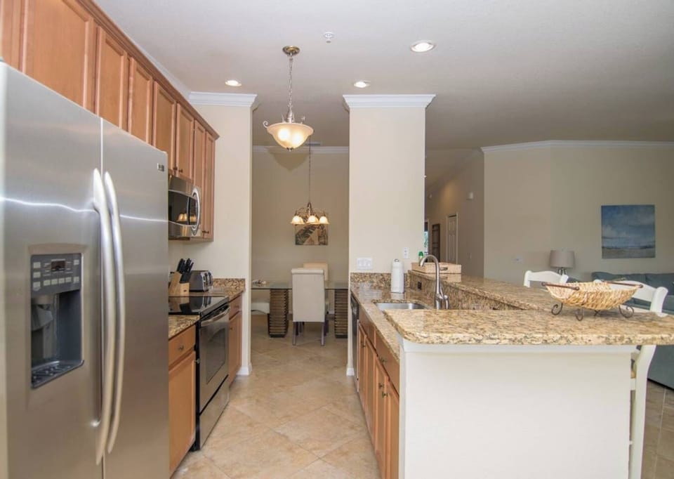 The Kitchen of Condo is Open to the Family Room