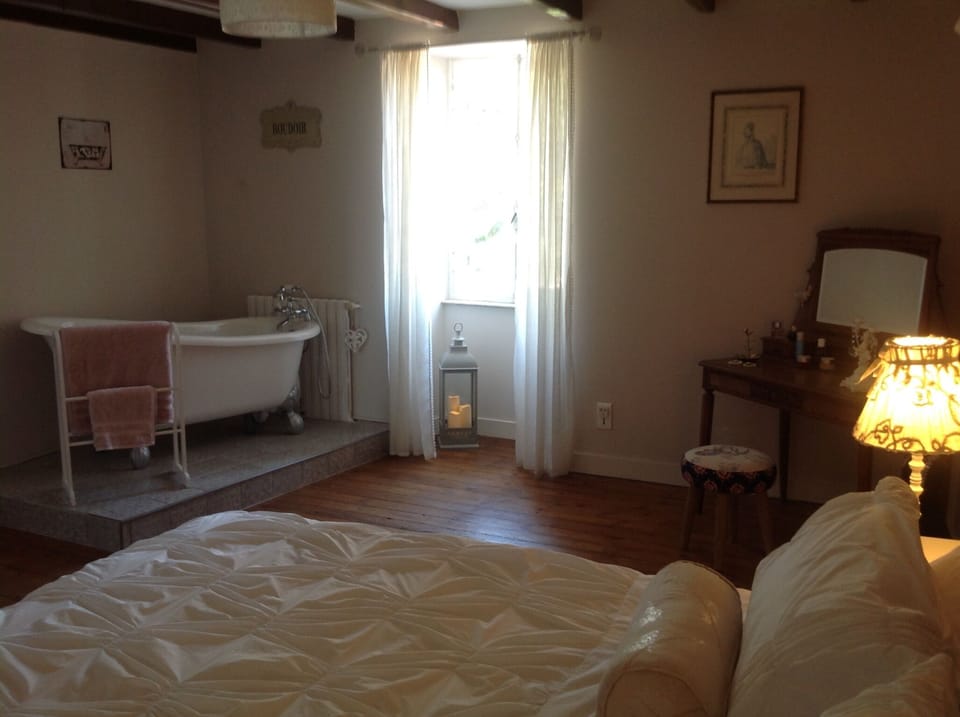 super king room with roll top bath and a view