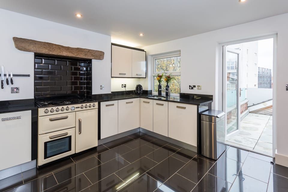 Hidden away are washing machine and dishwasher a Coffee machine & capsules.