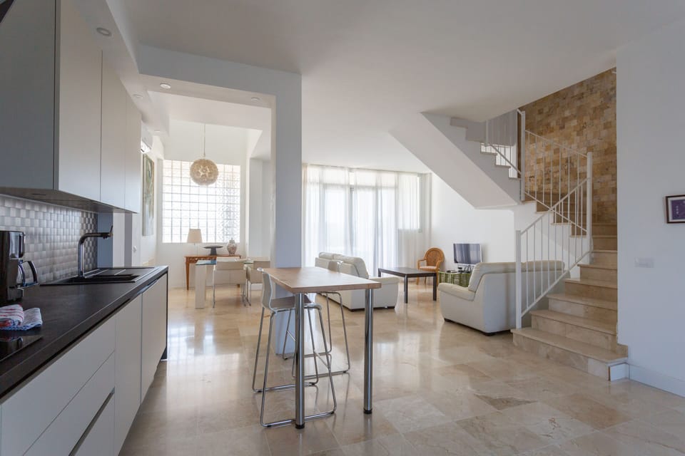 Spacious and bright living room and direct access to the terrace