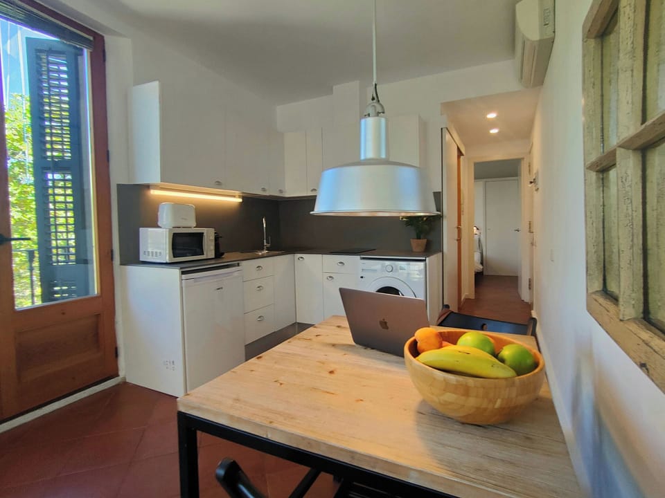 Cook like at home with a fully equipped kitchen — it even includes a washing machine for extra convenience during your stay.