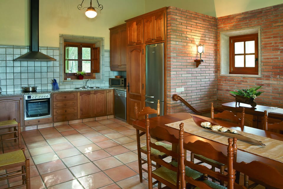 This is the kitchen/dining area with WC in the house behind terrace above pool.