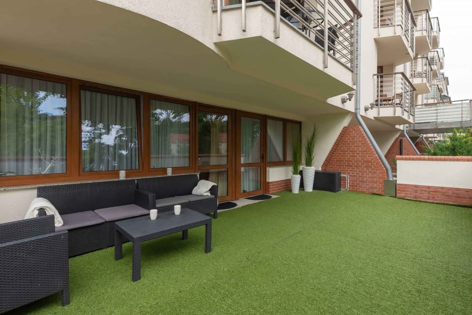 Large terrace with furniture that provides a comfortable space to spend time outdoors.