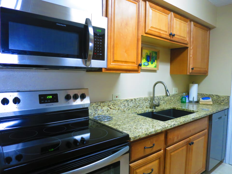 THE KITCHEN HAS ALL NEW STAINLESS STEEL APPLIANCES AND GRANITE COUNTERS