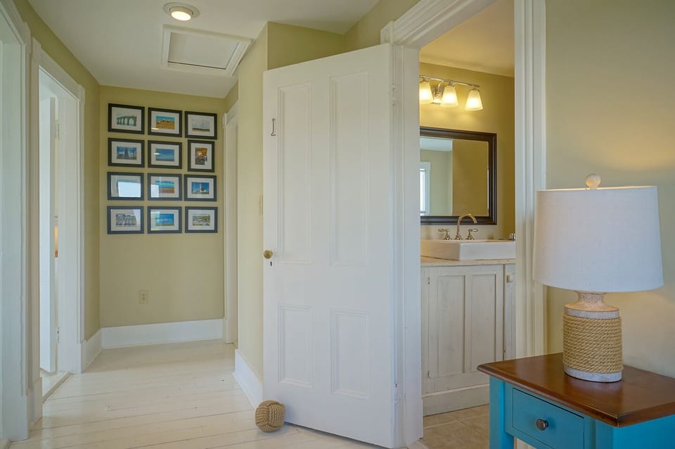 Upstairs hallway and view into bathroom
