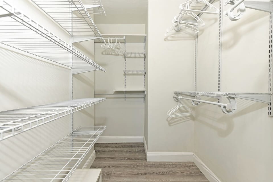 Well designed & functional primary bedroom walk-in closet