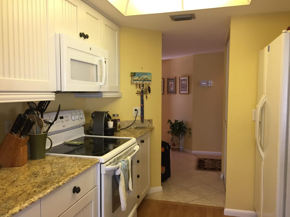 Entrance way that leads into kitchen, bedrooms and living room