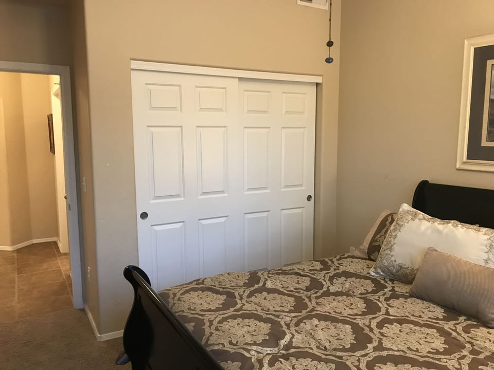 Second bedroom looking down the hall to the main bath.