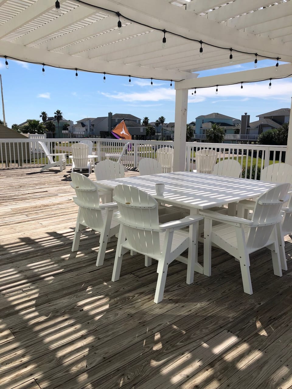 Enjoy your meals alfresco under the lighted pergola. The table seats 8. 