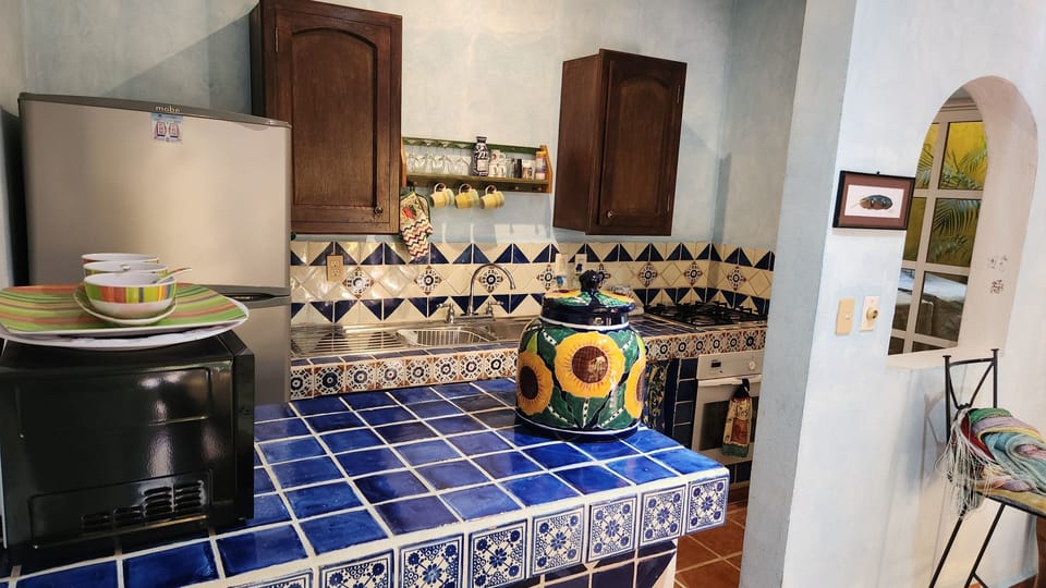 A well-equipped kitchen is found in each villa.