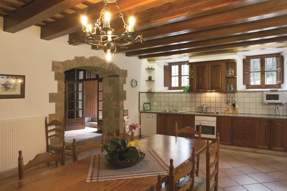 The 3 BR flat kitchen and exit to the back BBQ area, beautiful stone & tilework!