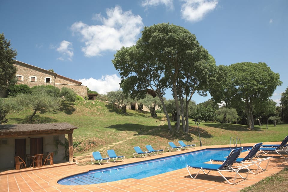 Large pool, with poolhouse w WC &  shower & sitting areas & shaded play  areas..