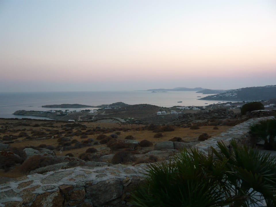 Views of the unspoiled natural landscape and of Mykonos bays, Delos and Rheneia