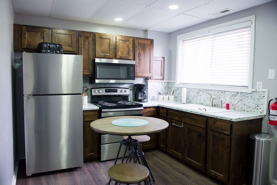 Kitchen with Small Bar height table and 4 stools,  Fully equipped