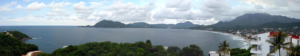Balcony panoramic view of the Pacific Ocean (left) and Santiago Bay