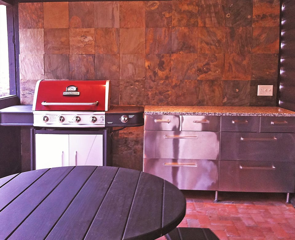 Gas Grill located on the side screened-in porch in our Pennsylvania cabin rental