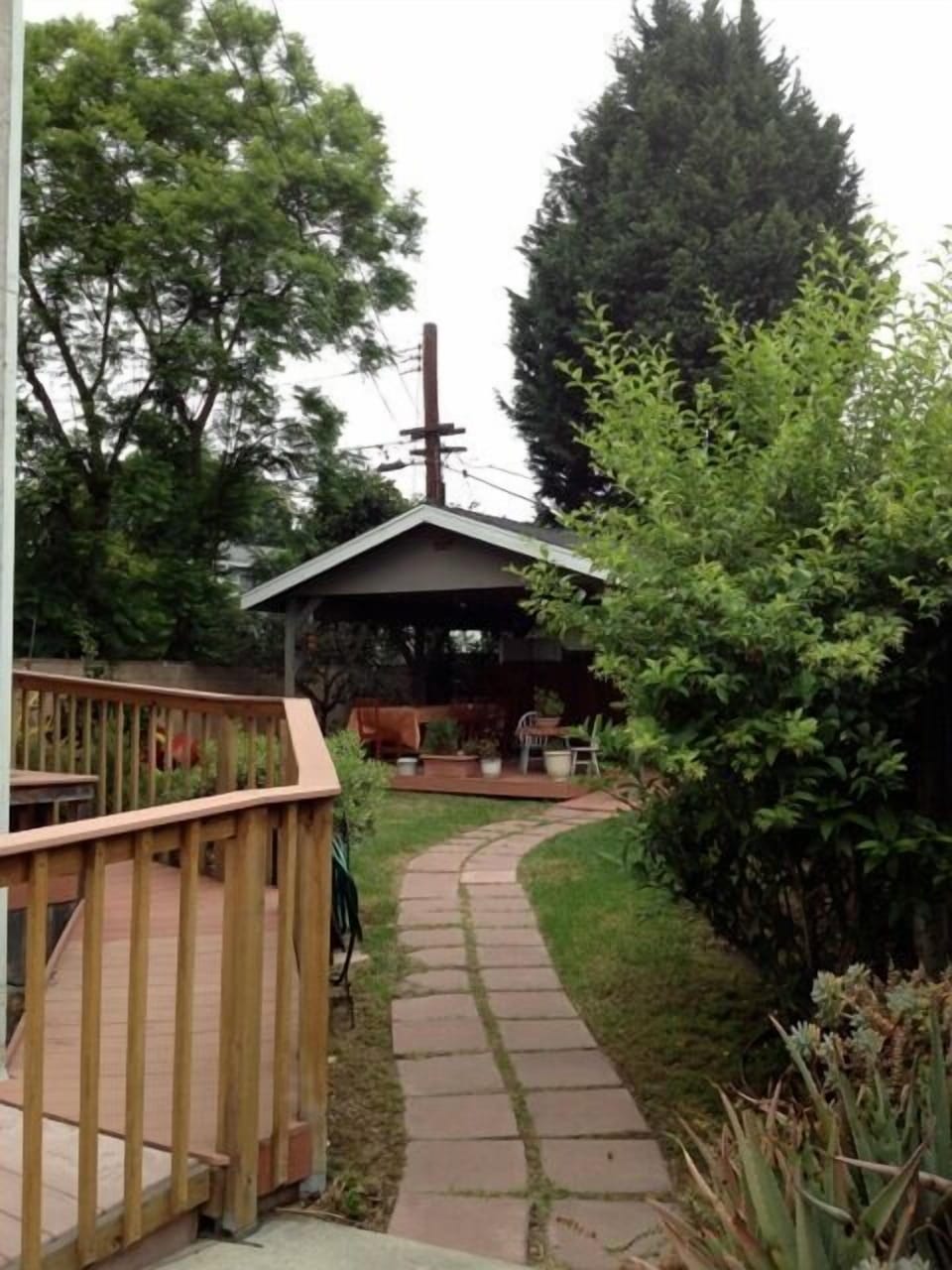 From side of house to back yard.  Note ramp to back rooms & porch. 