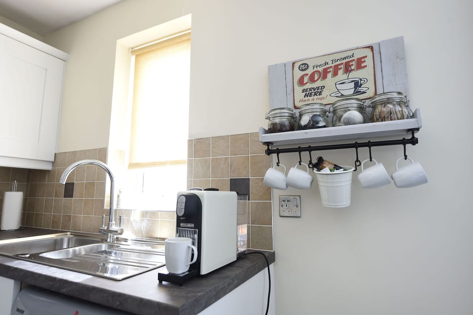 Enjoy a coffee fix with a Nespresso machine. Tea and coffee is provided.