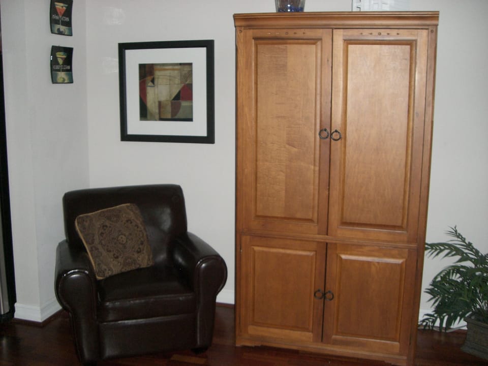 ARMOIRE IN LIVING ROOM