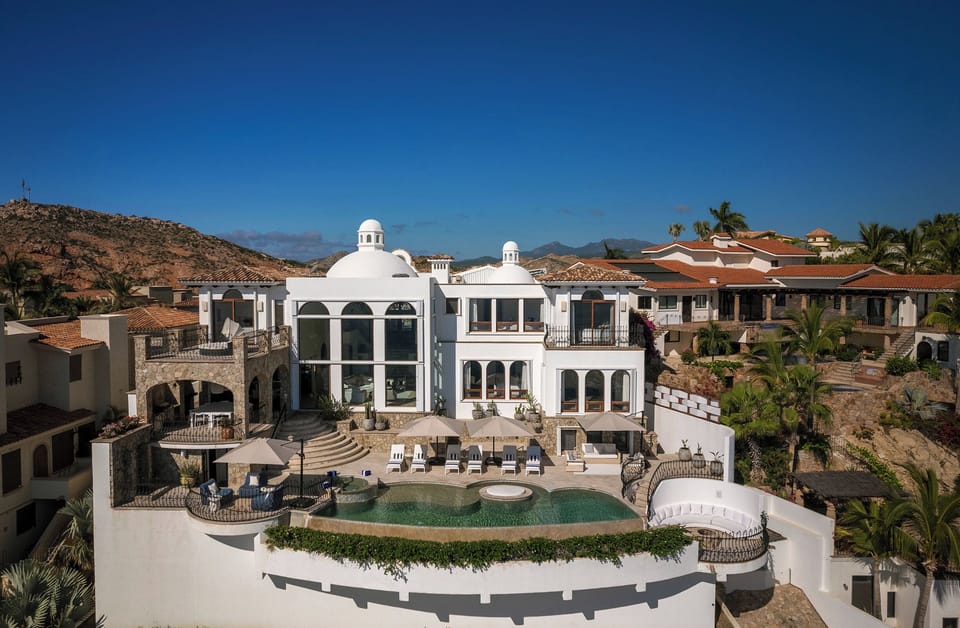 Aerial view of Casa Rio de Luna's domed towers and infinity pool in Rancho Cerro Colorado, Los Cabos.