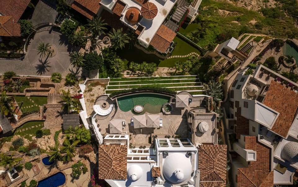 Overhead aerial of Casa Rio de Luna's roofs, pool and gardens, Rancho Cerro Colorado, Los Cabos.