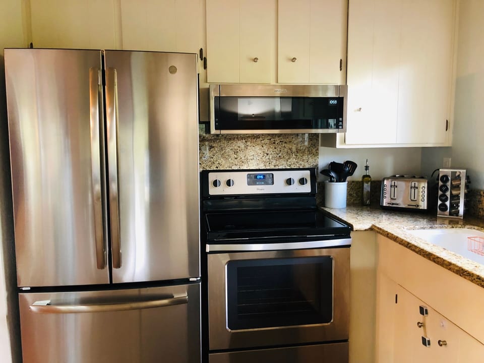 Fully stocked kitchen with brand new stainless steel appliances 